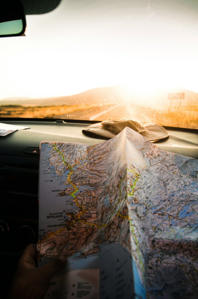 Iceland Ring Road itinerary map with sunset view from car