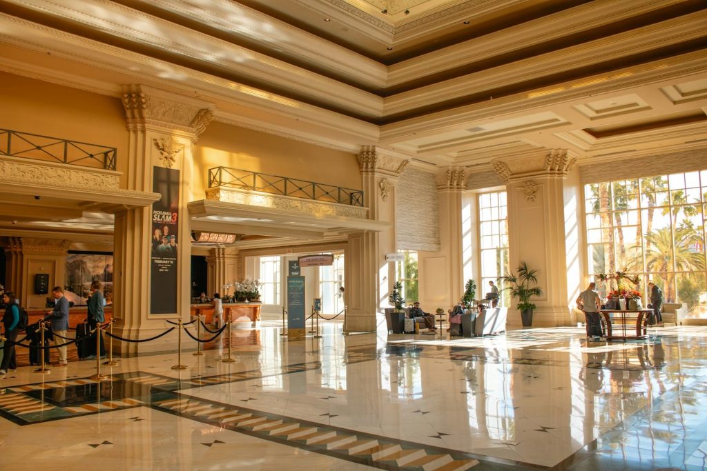 Luxury hotel grand lobby with marble floors and columns for corporate loyalty program members 2025
